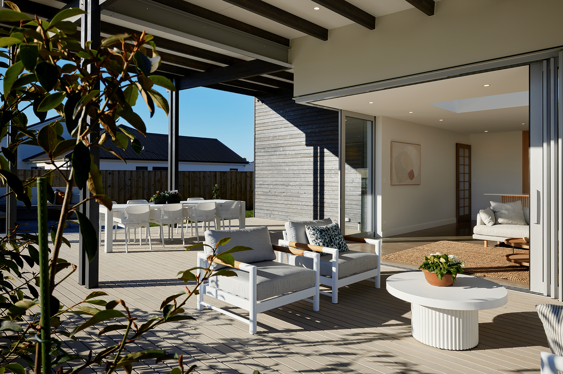 Outdoor living space with white furniture