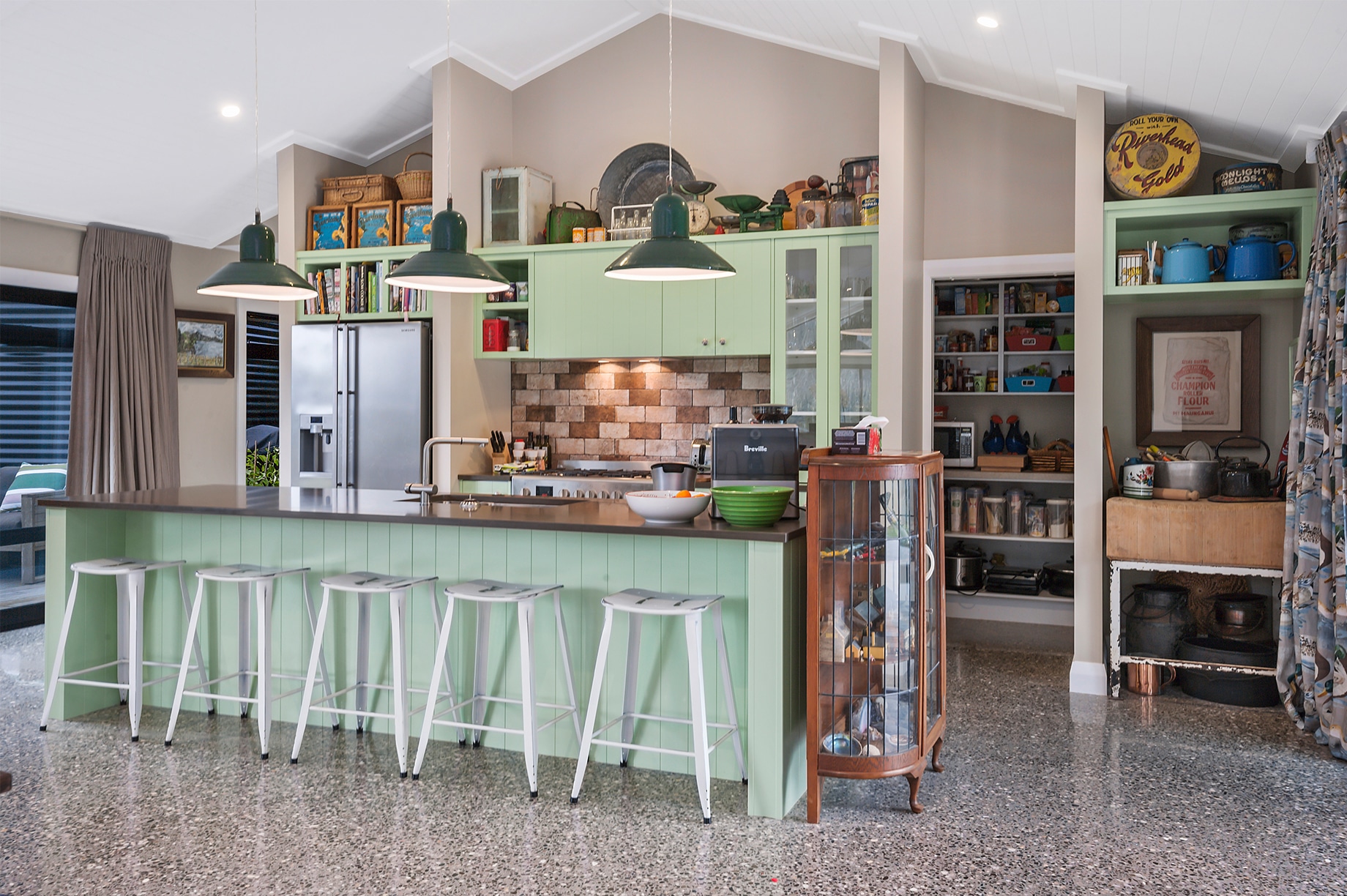 Mint coloured kitchen interior with hanging lights