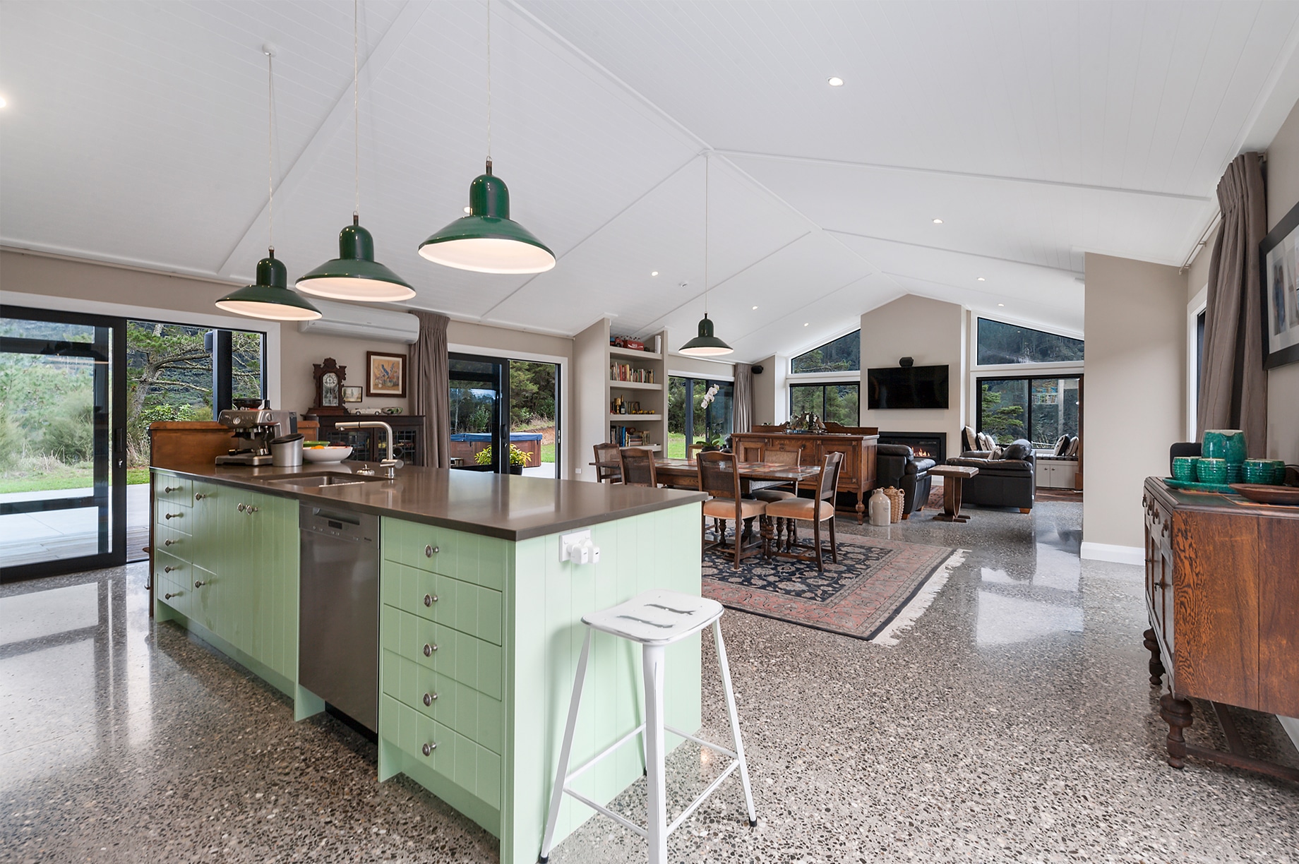 Large living area of a home with a mint kitchen island