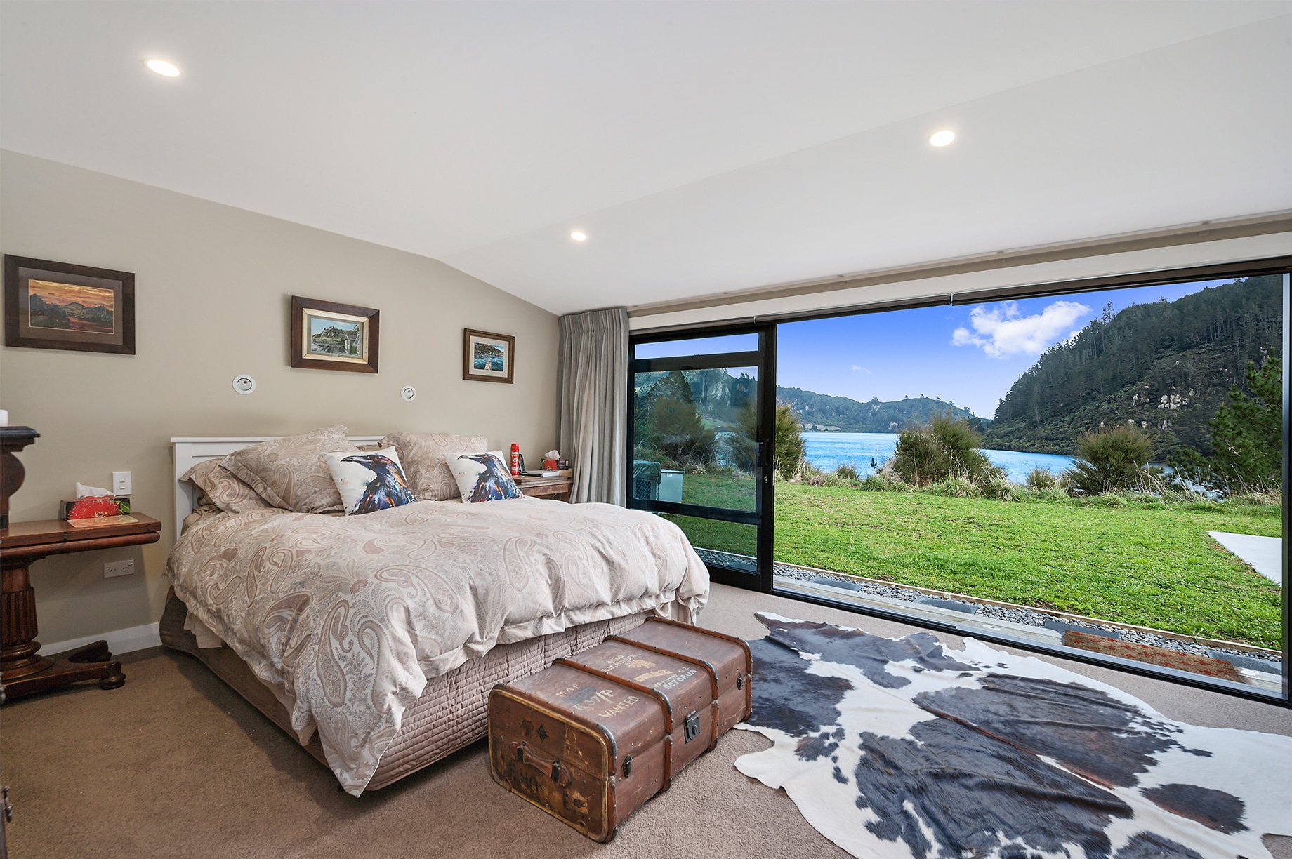 Mater bedroom with a lake view