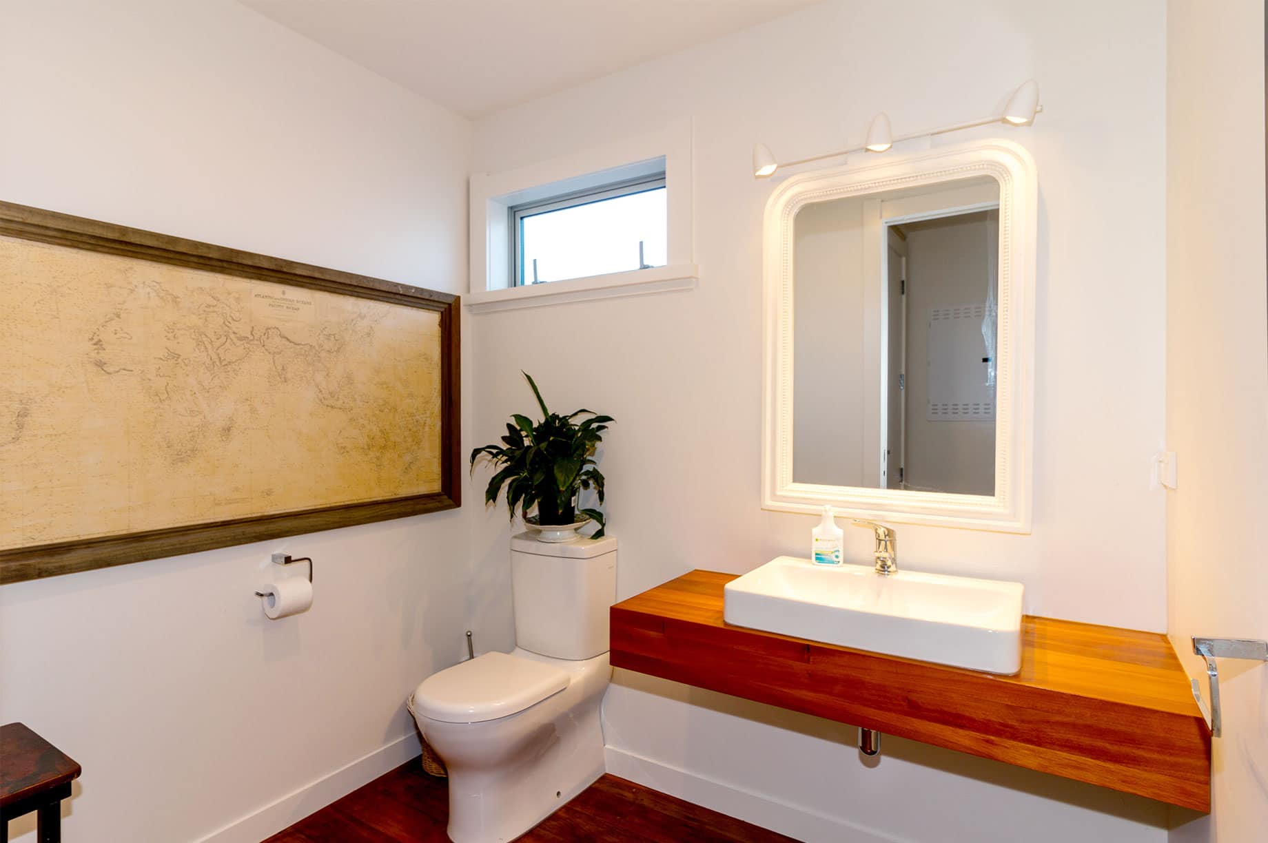 White bathroom with world map picture