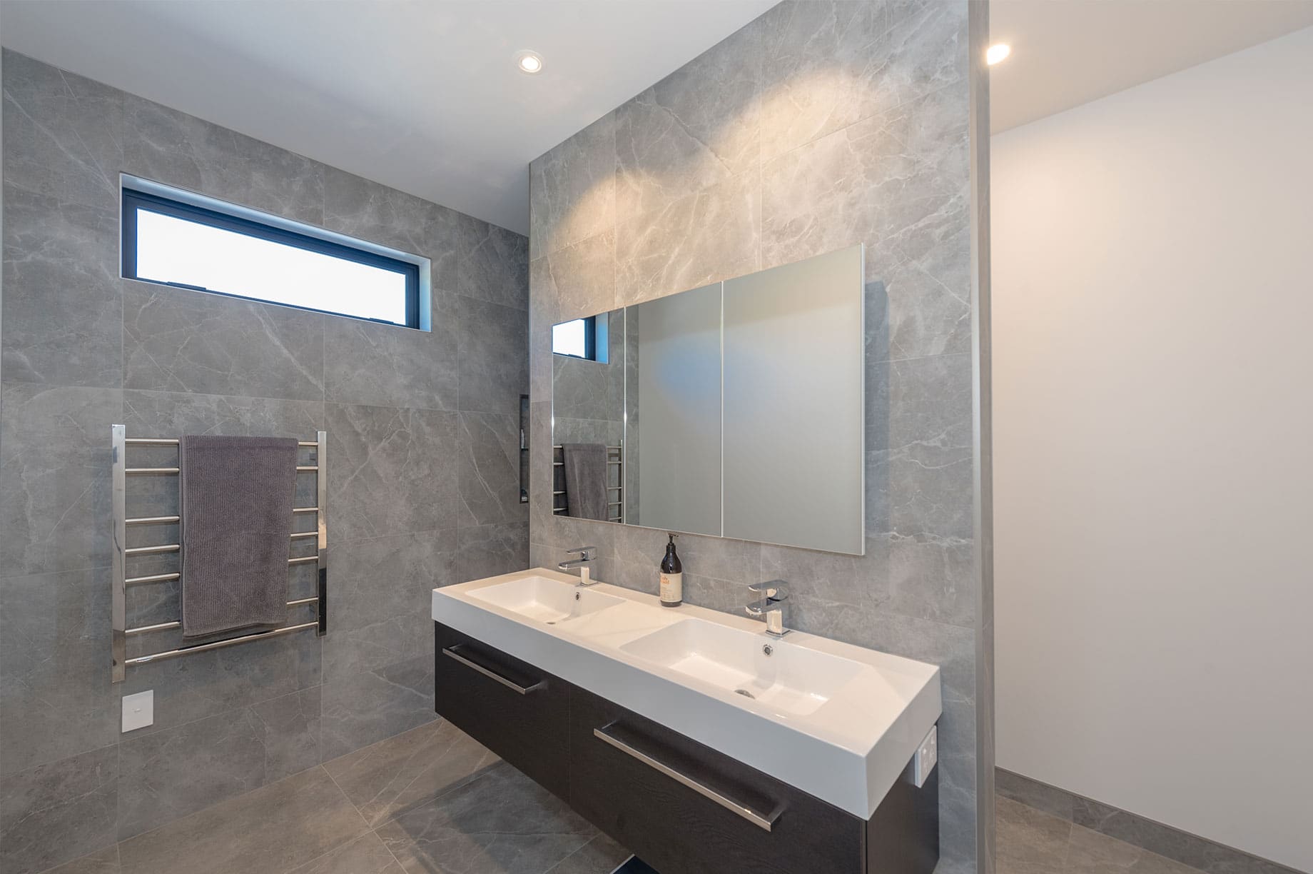 Grey marble tiled bathroom interior