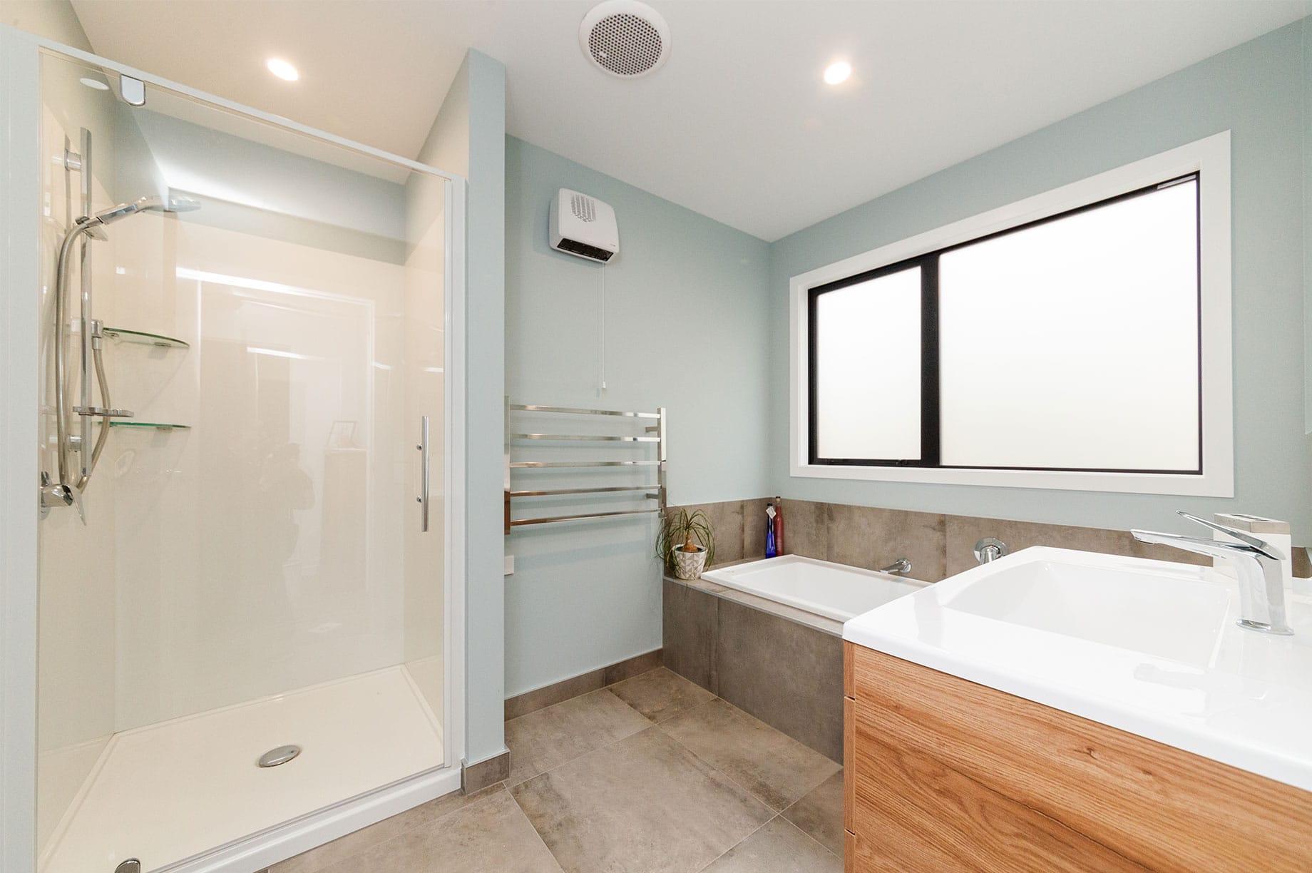 Bathroom interior with light blue coloured walls