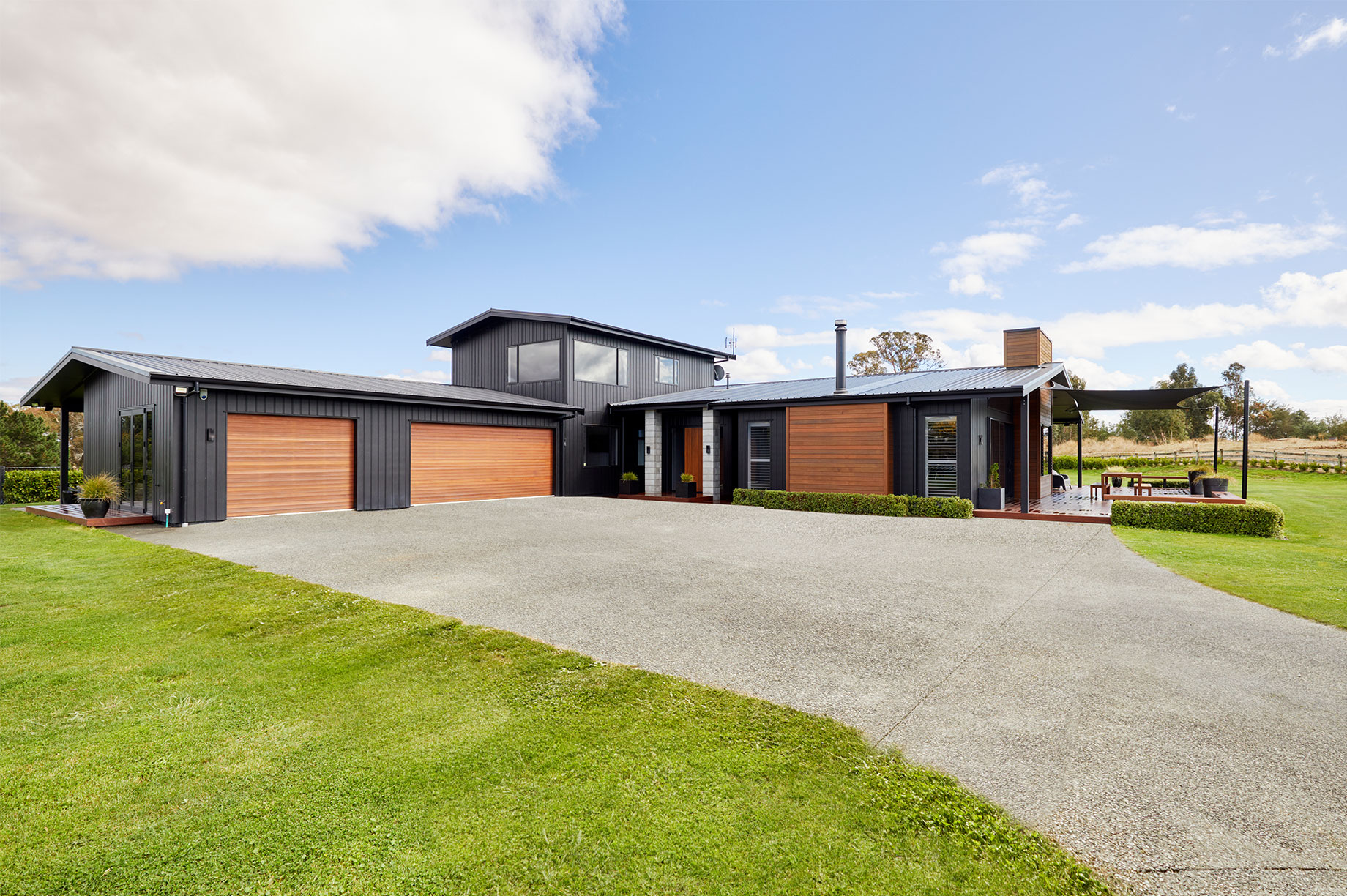 Rural house exterior with a large driveway