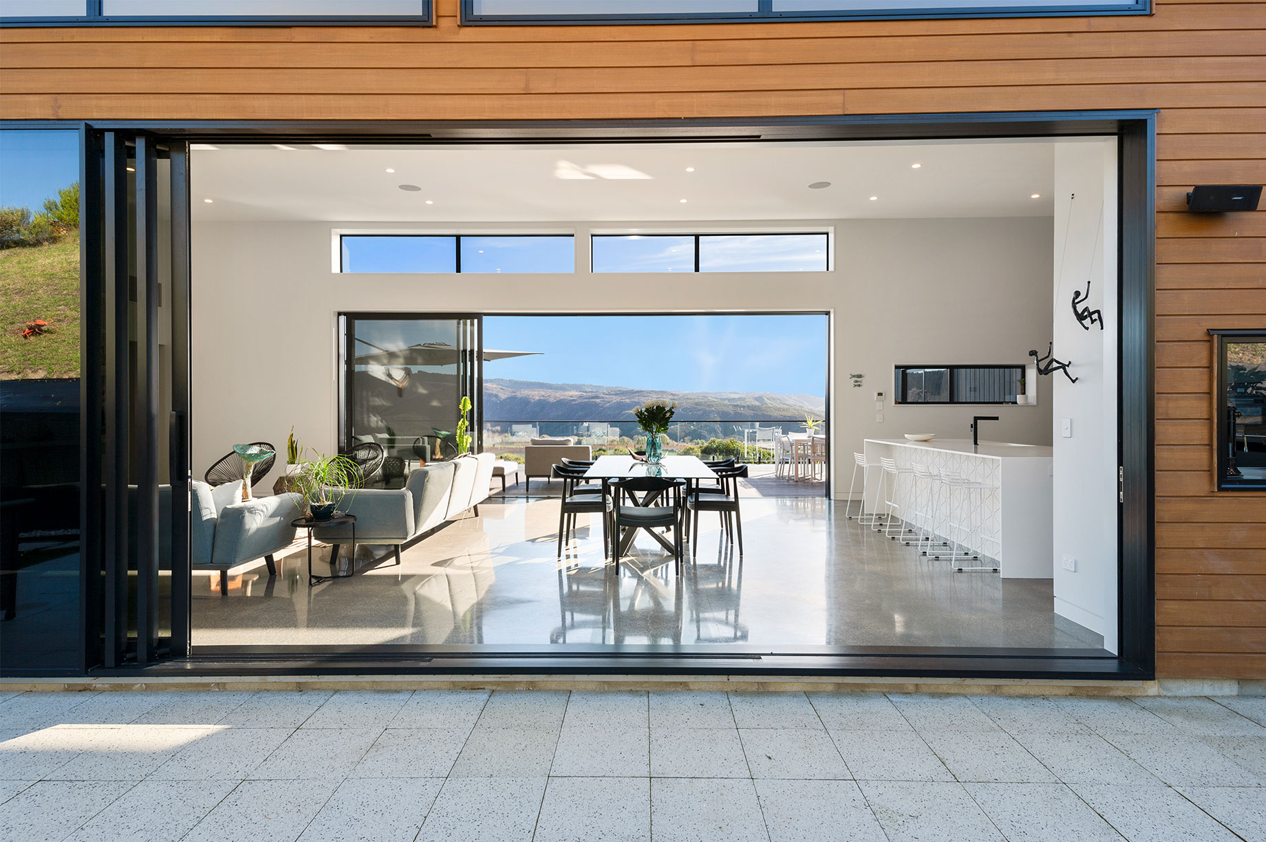 Open floor living area with a hill view