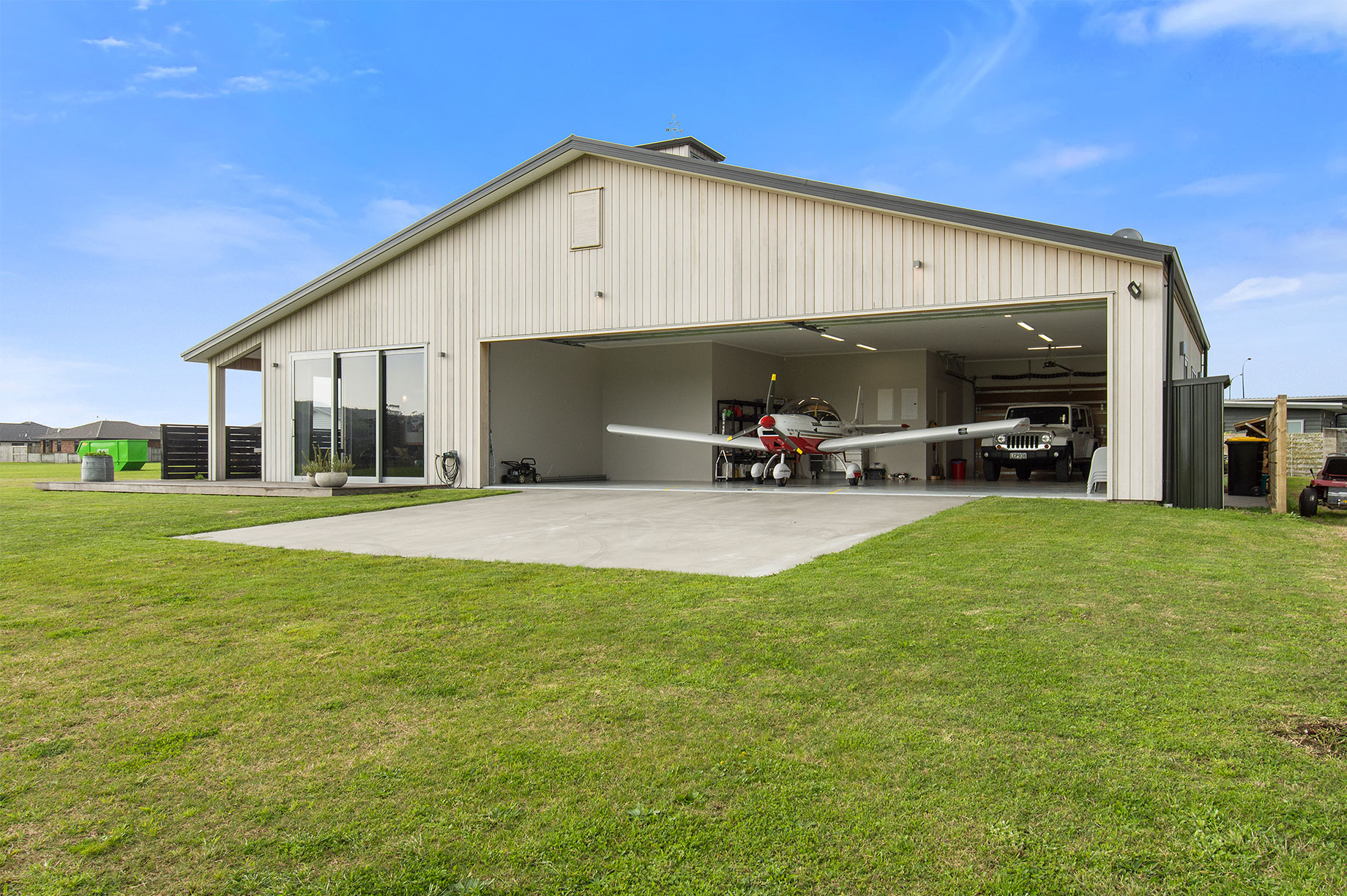 House with a small plane garage exterior