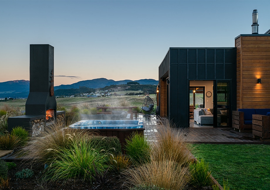 Rural home outdoor living area with a spa