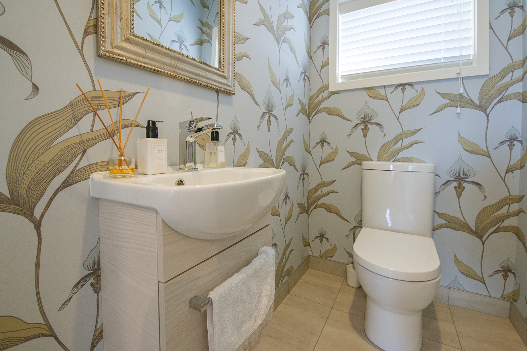 Bathroom interior with floral wallpaper