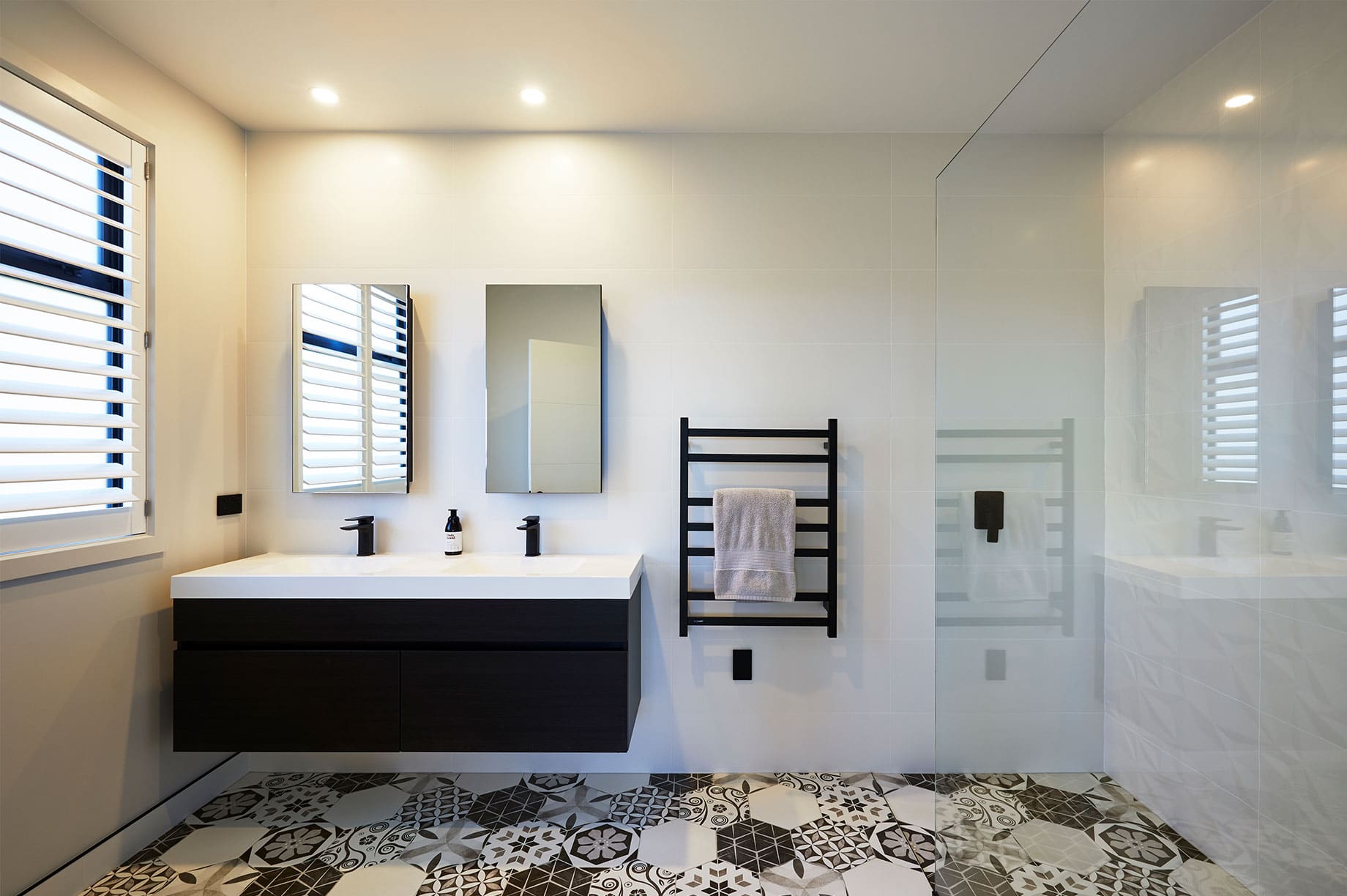 White bathroom interior with black accents