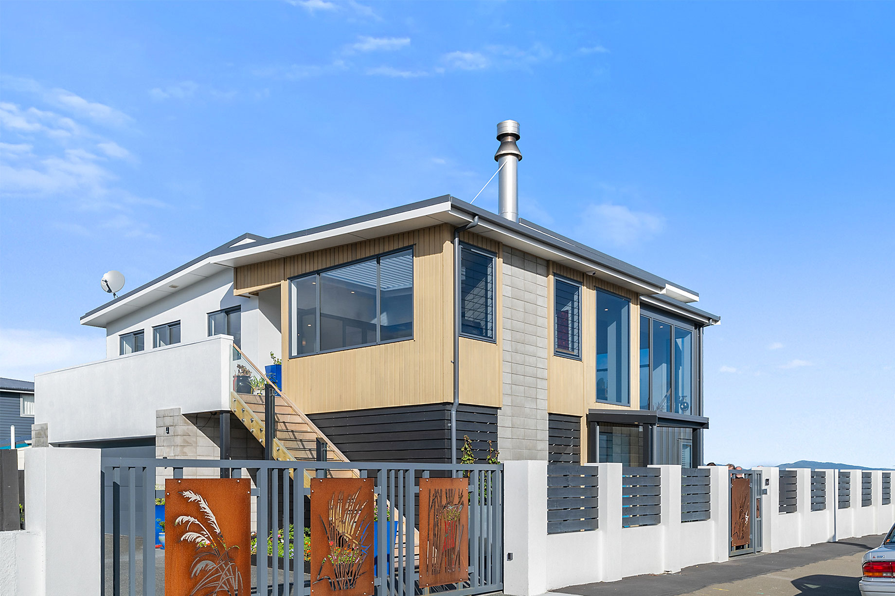 two storey home with metal fencing