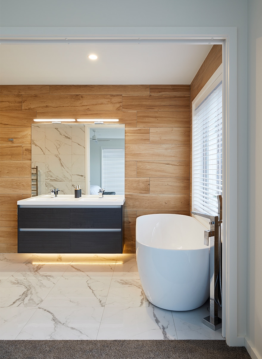 Bathroom with wooden walls and white floor tiles