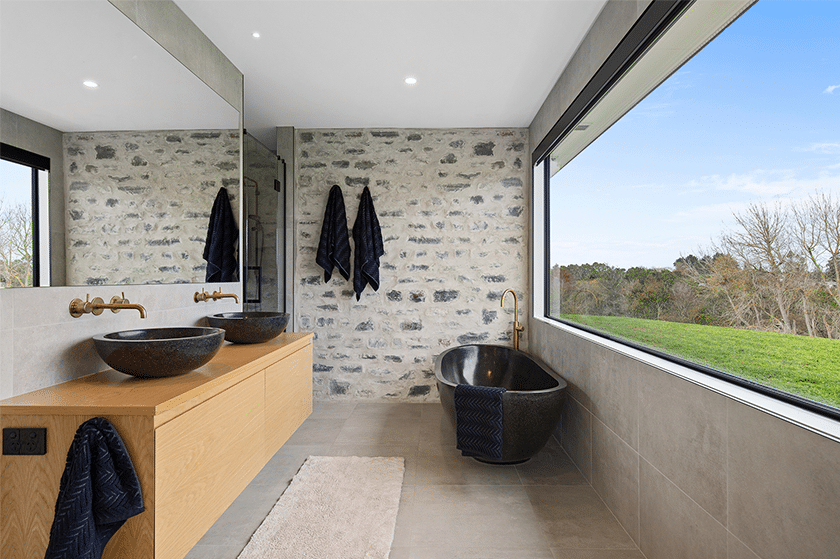Ensuite bathroom with a large window