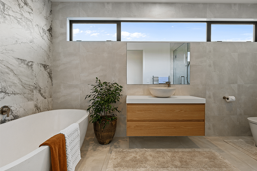 beige bathroom with wooden cabinet