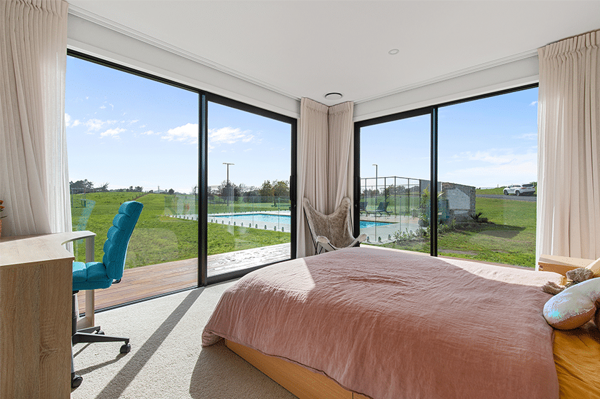 Bedroom with a view of the outdoor pool