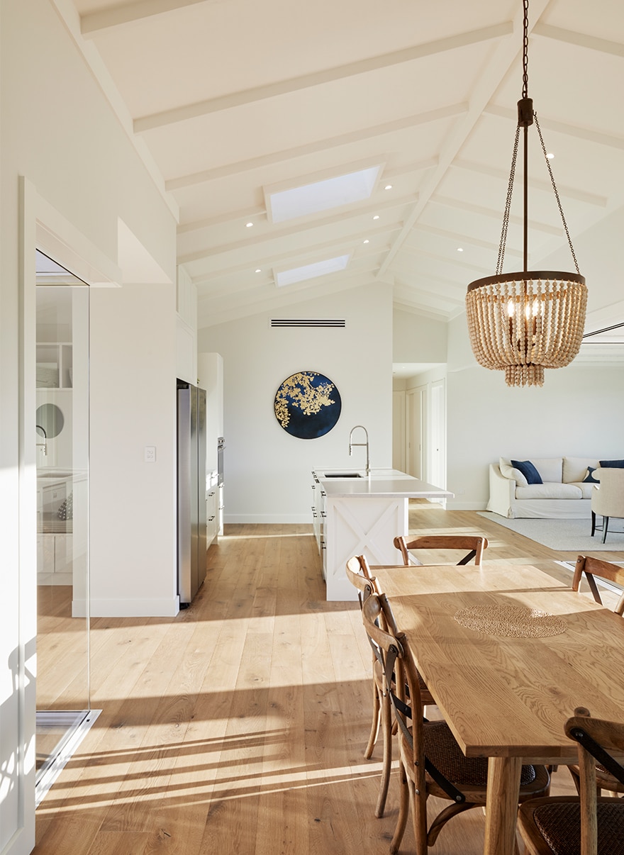Bay of plenty home with light interior and wooden dining furniture