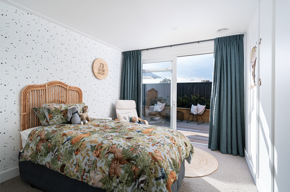 Bedroom with black dotted wallpaper