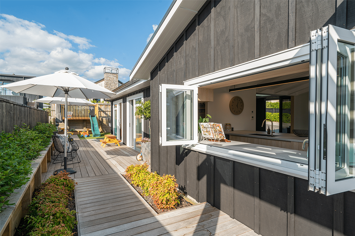 Outdoor living area looking into internal kitchen