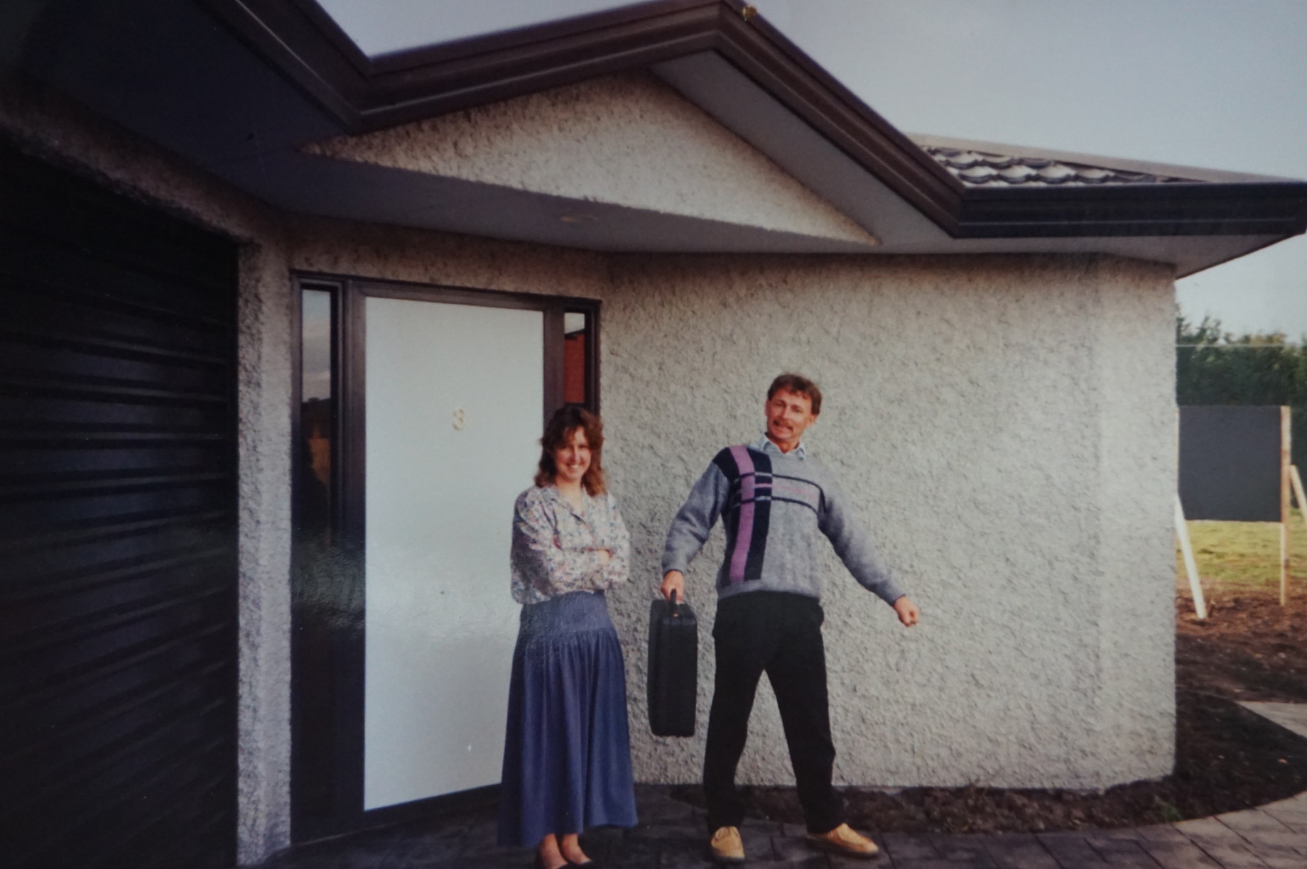 1995 Image of a couple outside their home