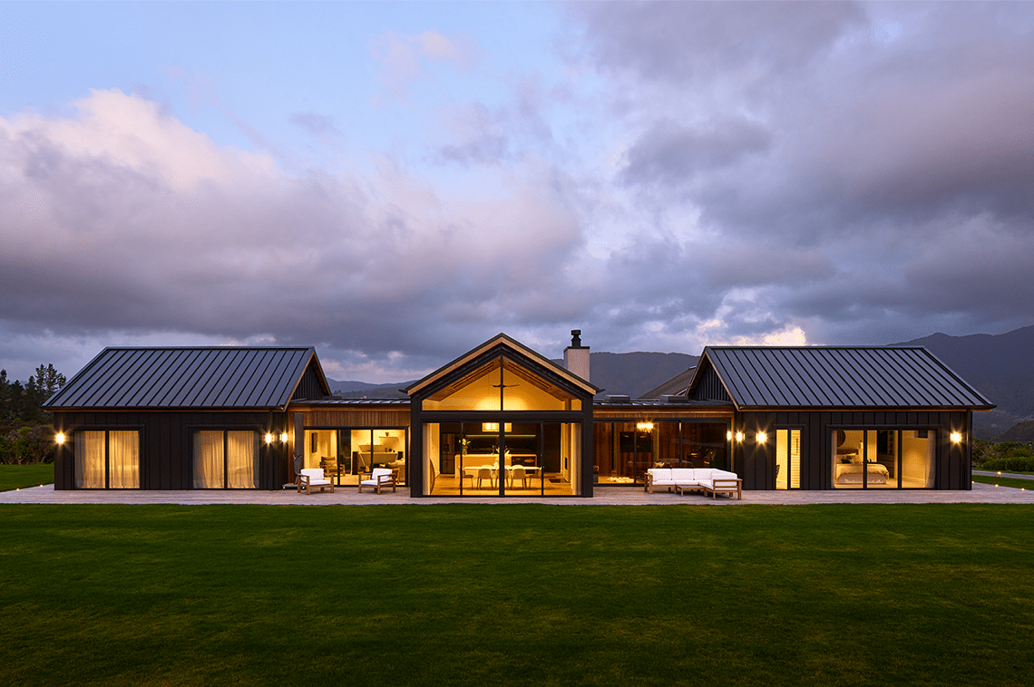 Large rural house exterior in evening time