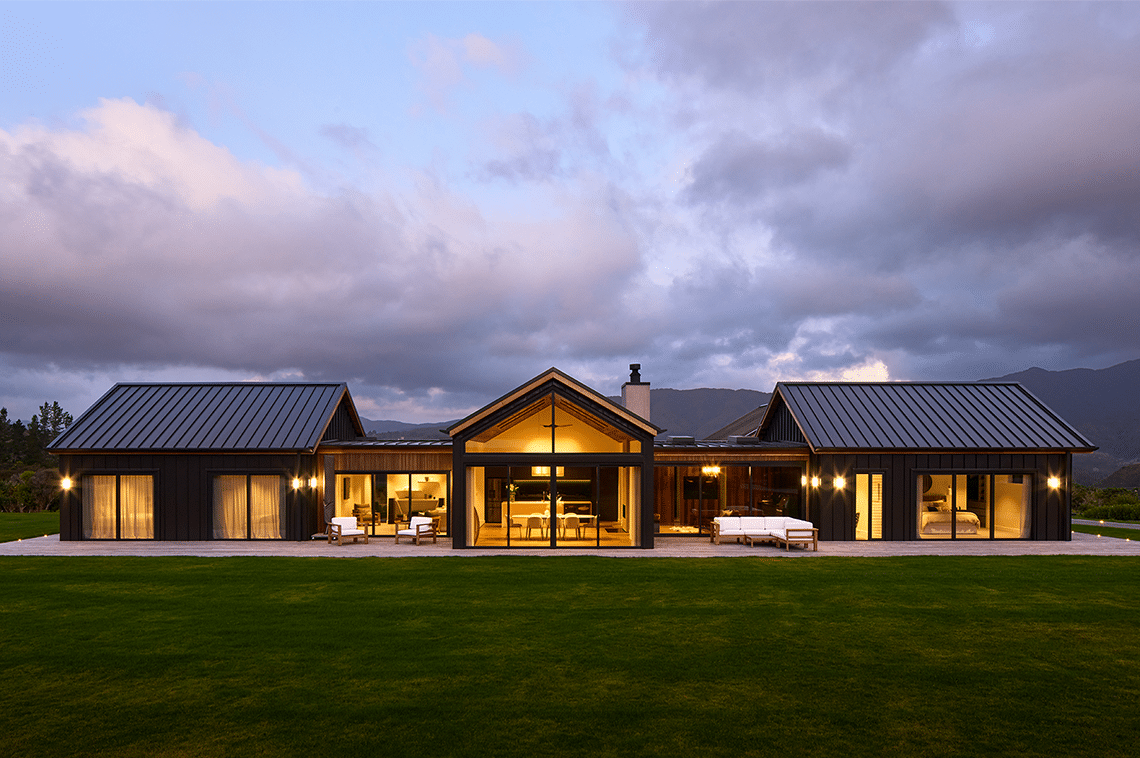 20029-external-lighting-lawn Large rural house exterior in evening time