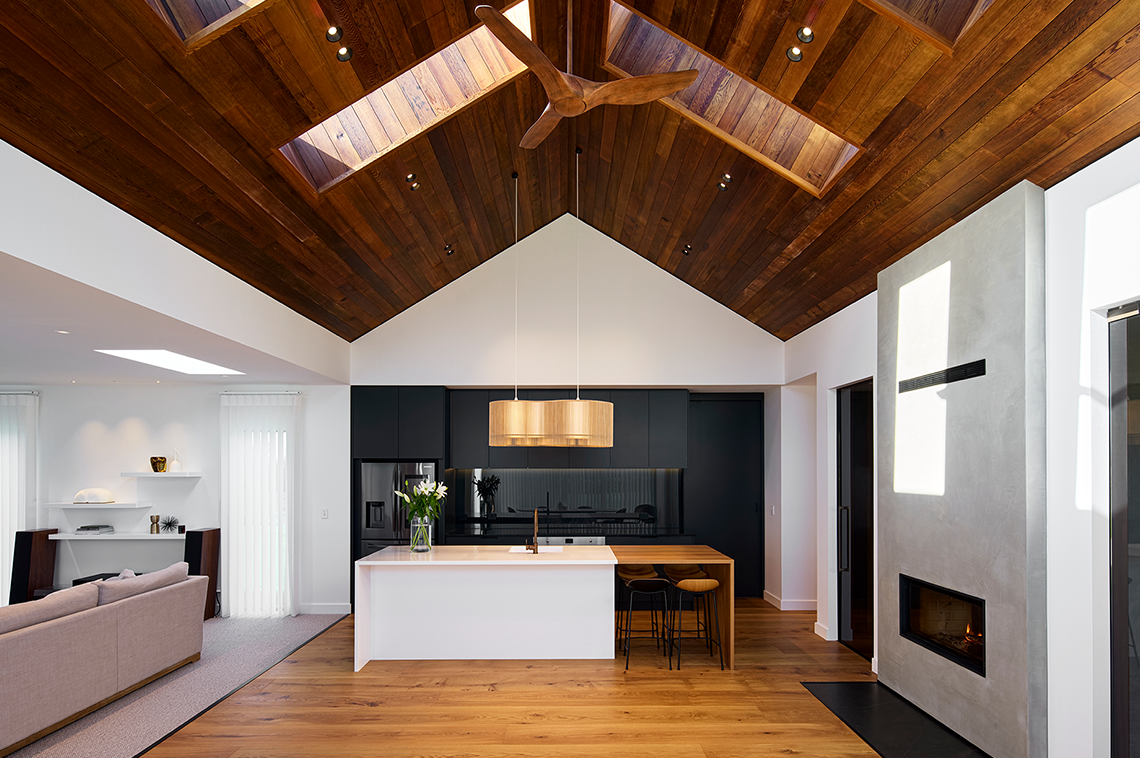 Kitchen and lounge space with timber ceilings