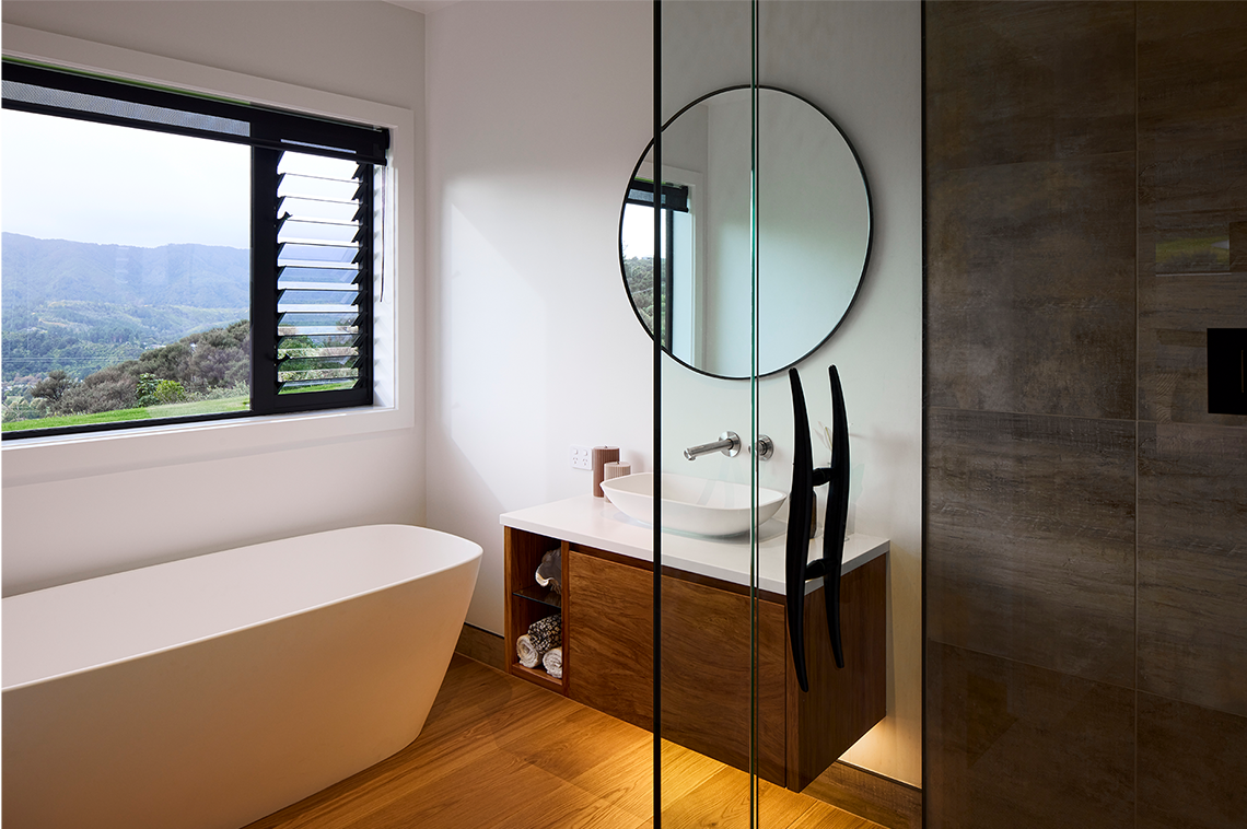 Master bathroom with a circular hanging mirror interior