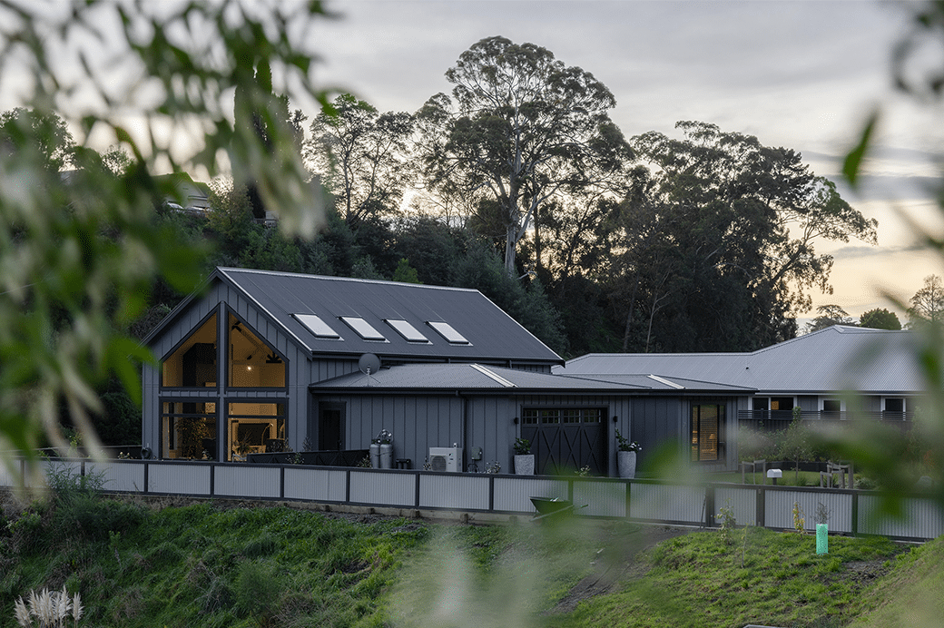 Grey house with large windows exterior