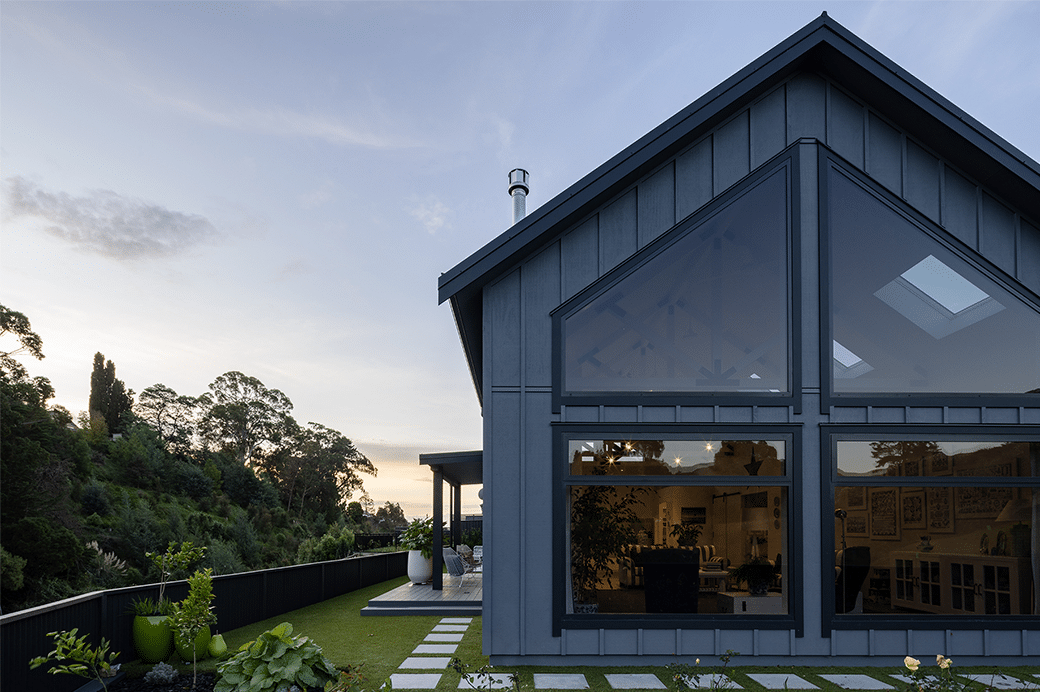 grey house with large windows exterior