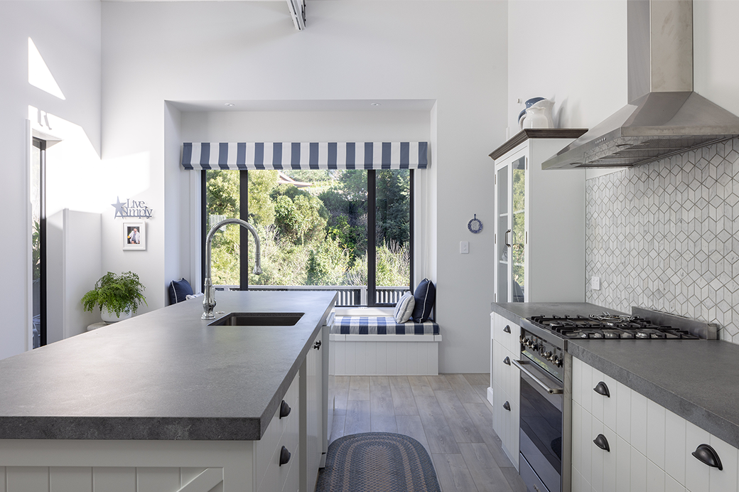 White and grey kitchen with a window seat interior