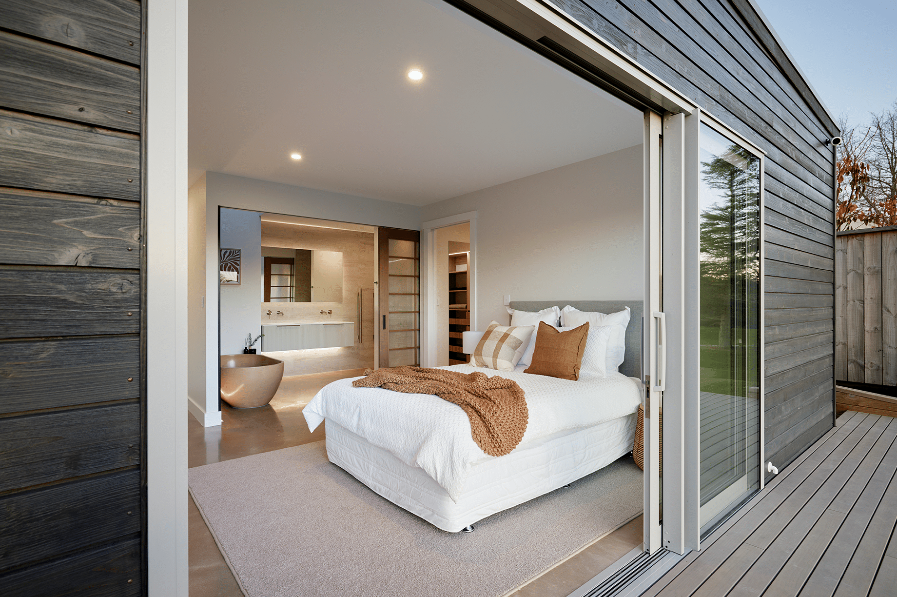 Neutral master bedroom with an ensuite