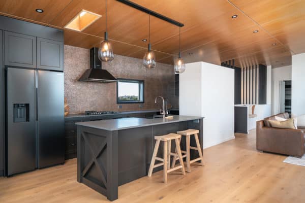 Black kitchen with wooden barstools interior