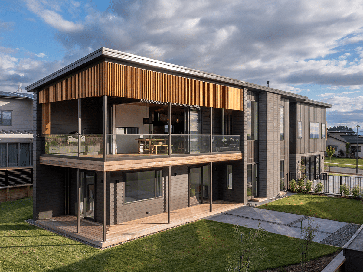 Large two storey house exterior on a sunny day