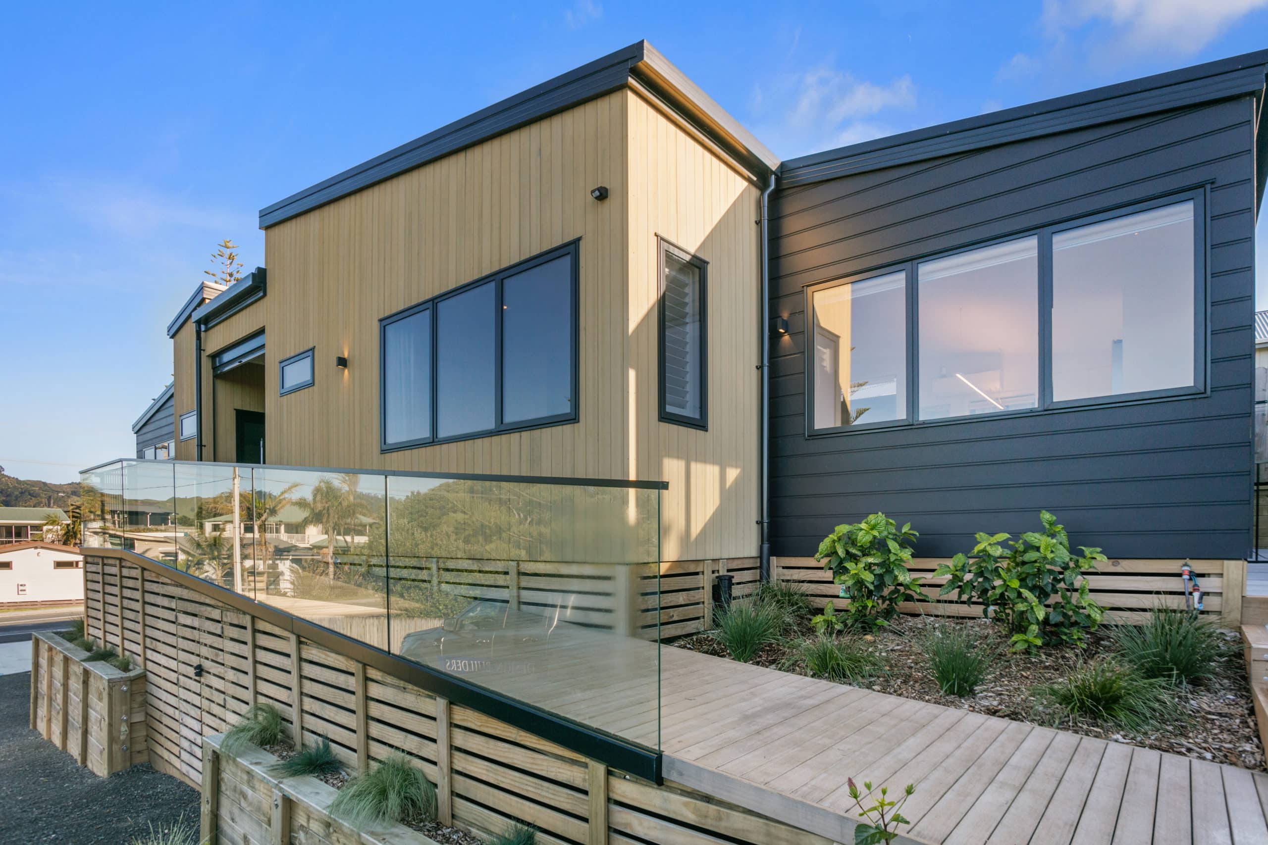 Outdoor home entrance with a wooden ramp