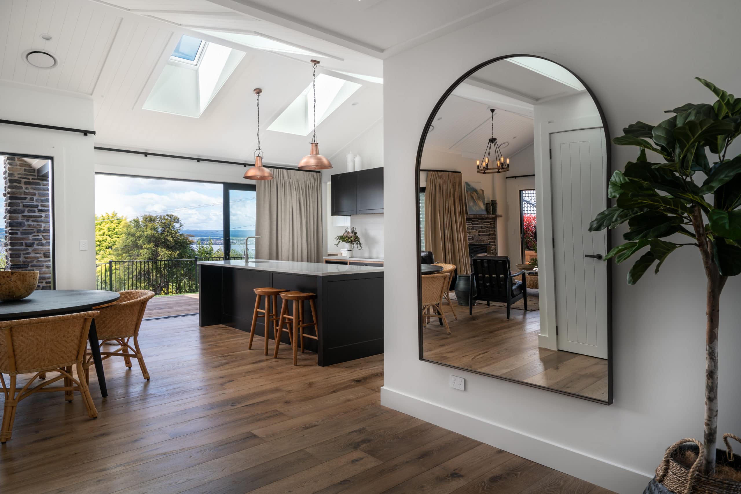 Kitchen and dining area with a large mirror