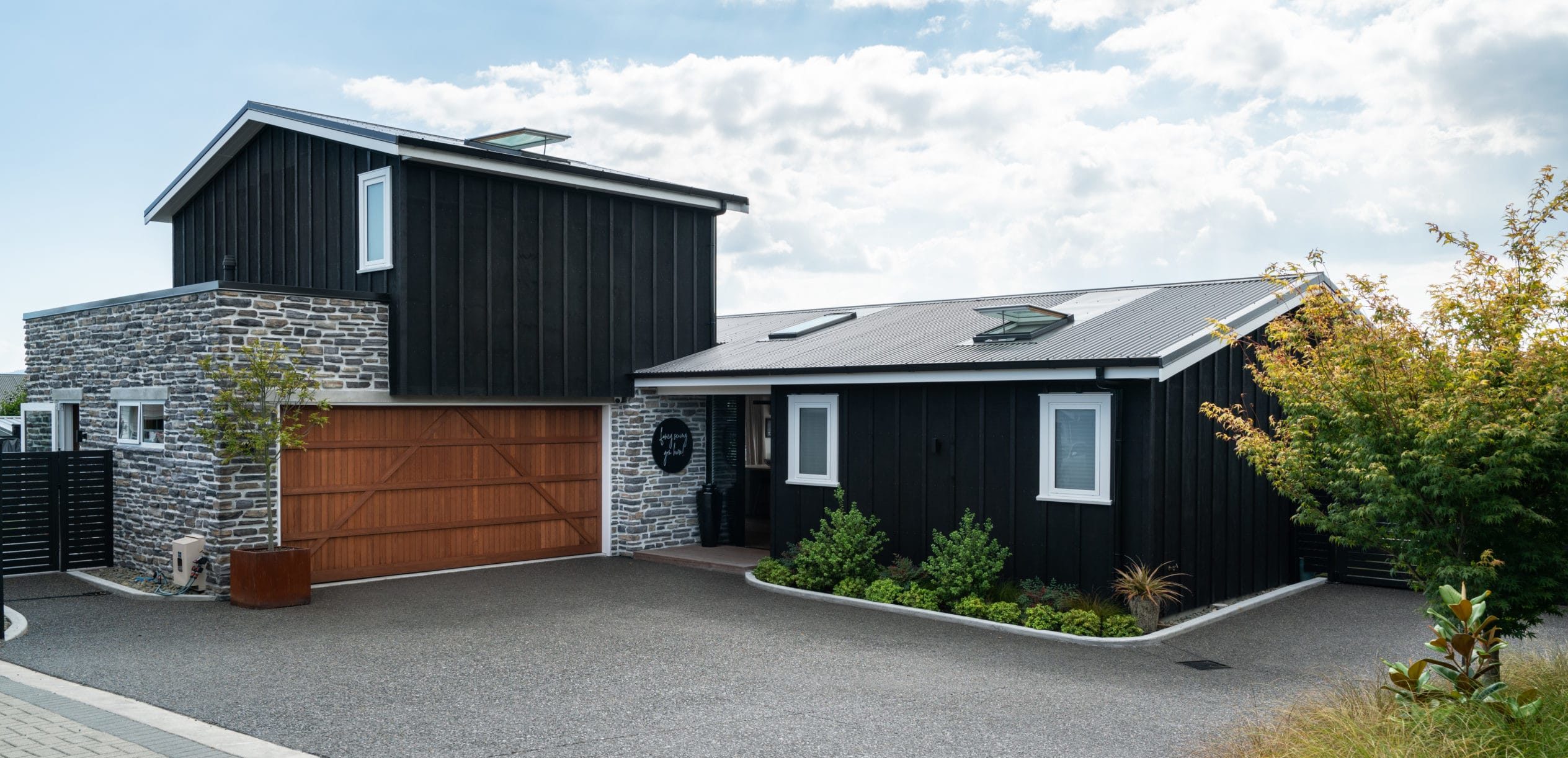 Exterior of a house with a large wooden garage door