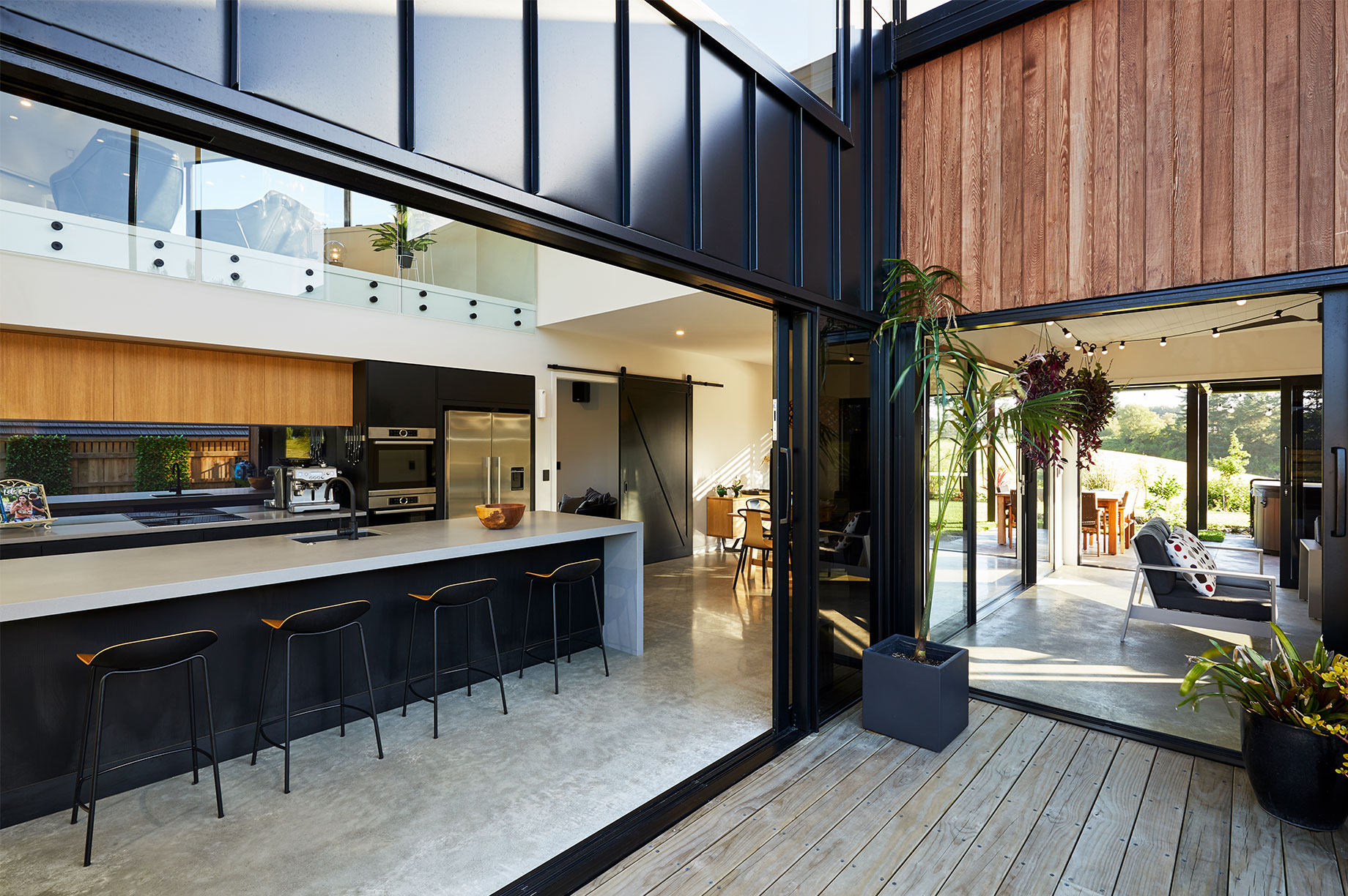 Black kitchen area with wooden accents