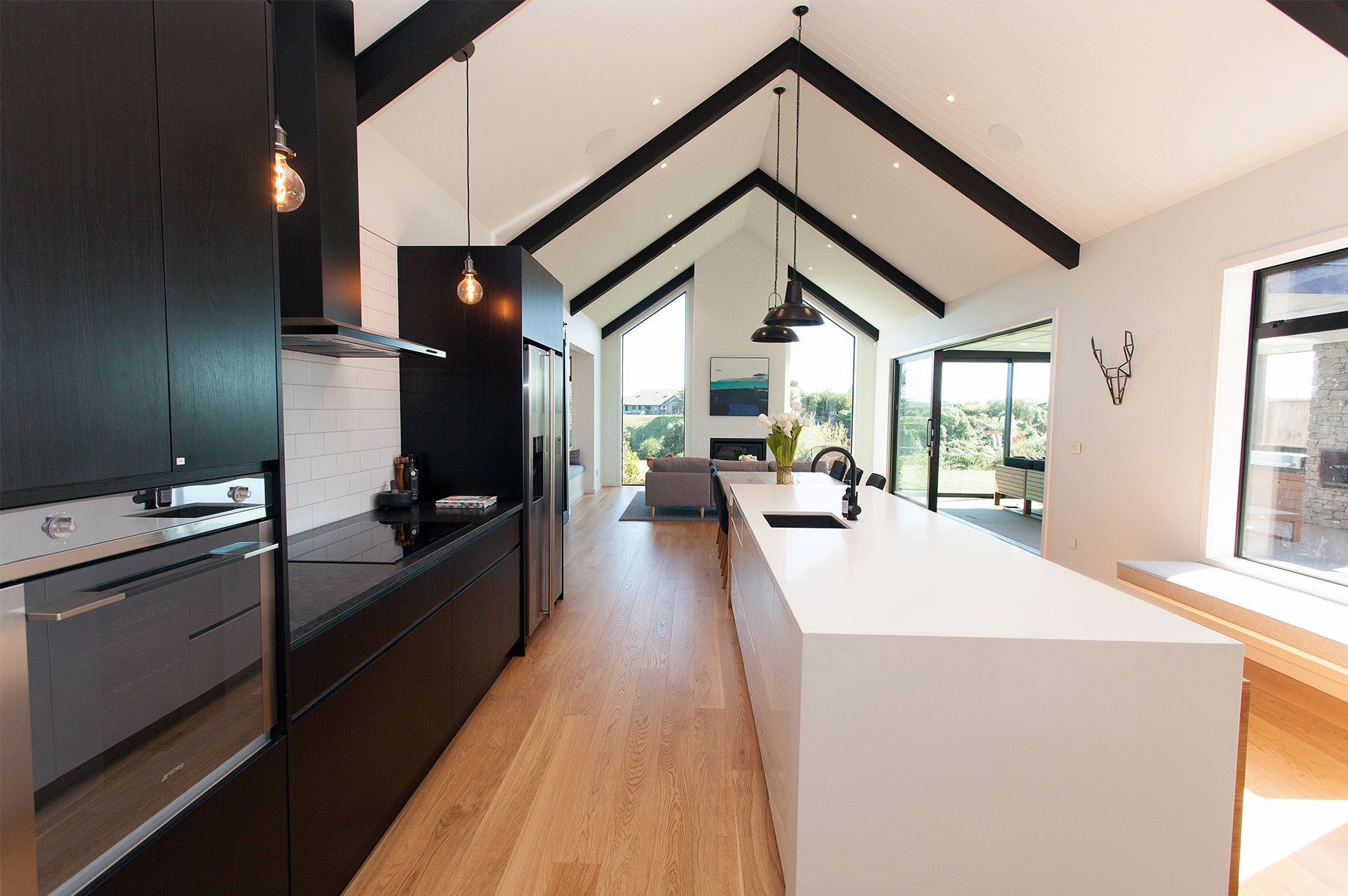 Black kitchen with white kitchen island interior
