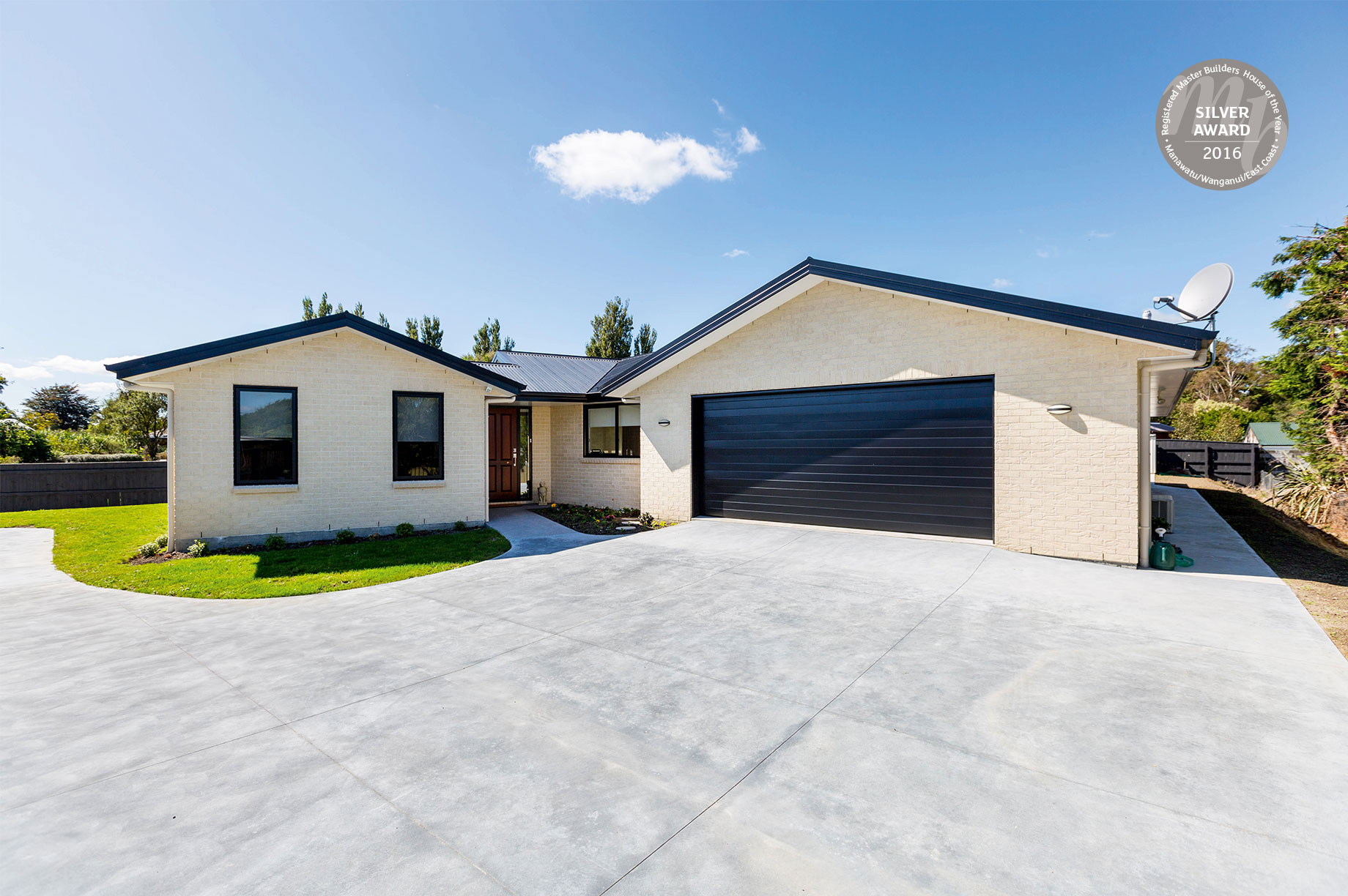 Beige home with black accents exterior