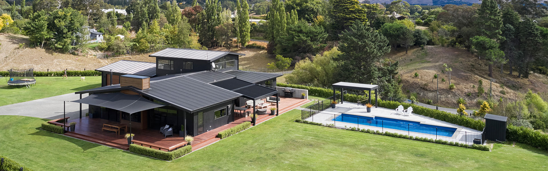 Large rural house with a pool exterior