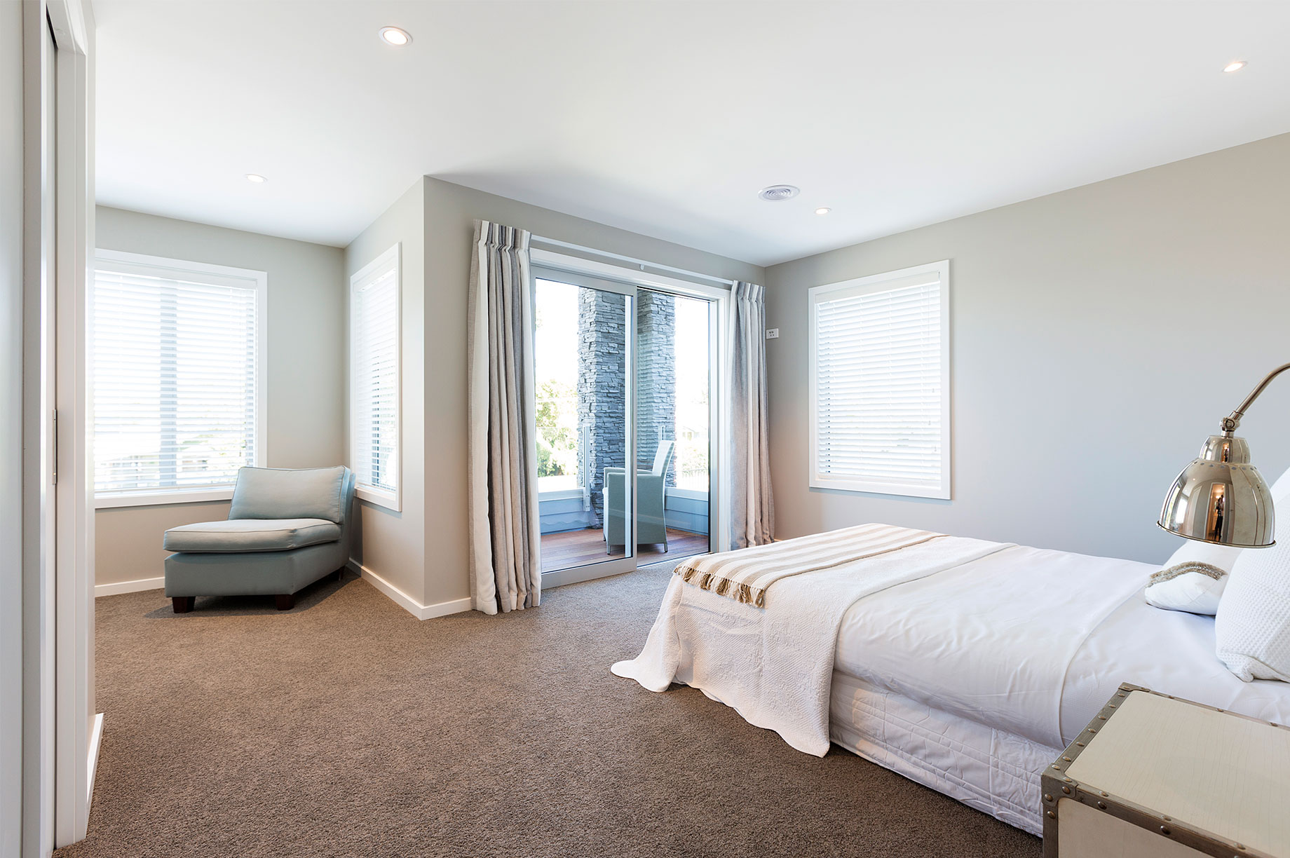Taupo home bedroom interior with outdoor entrance